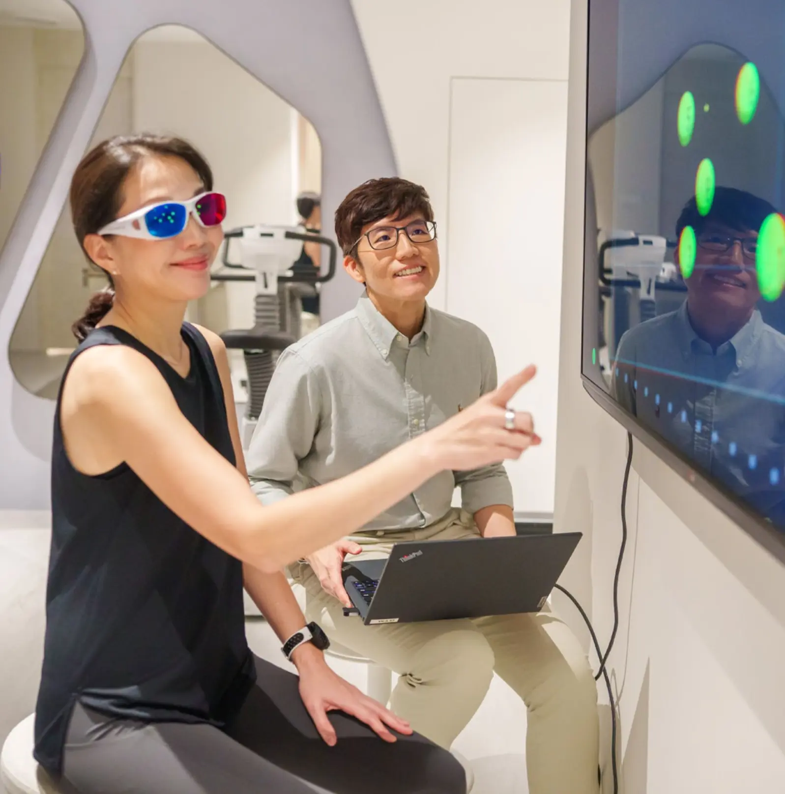 Client completing a gamified reaction-wall drill during the brain and body assessment at Chi Longevity.